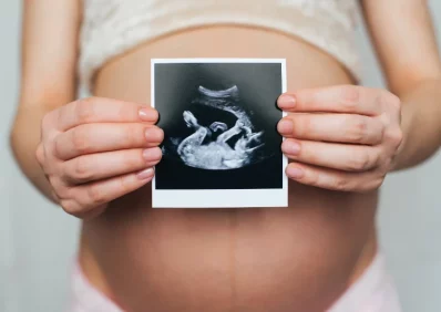 Mother showing baby scan